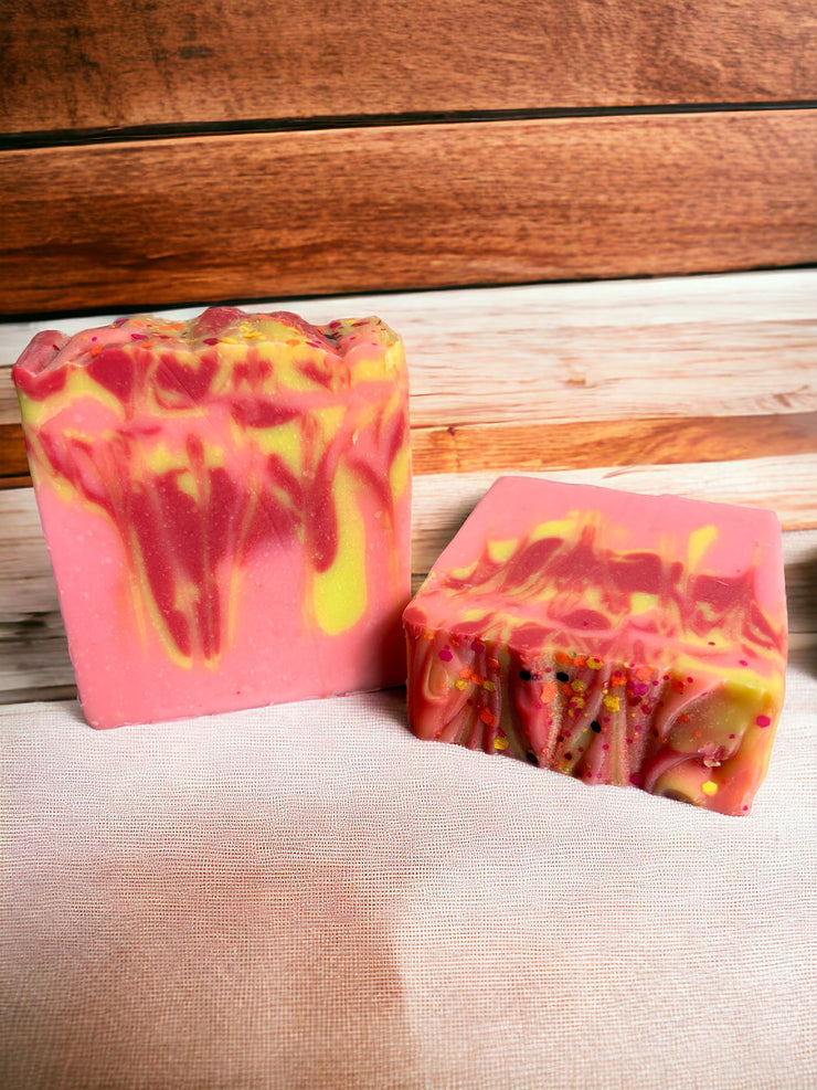 A bar of peach-scented soap with delicate swirls, evoking the fresh and fruity aroma of ripe peaches, perfect for a summer indulgence