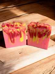  A vibrant bar of peach-colored soap  representing the refreshing essence of summer captured in our Peach Soap."